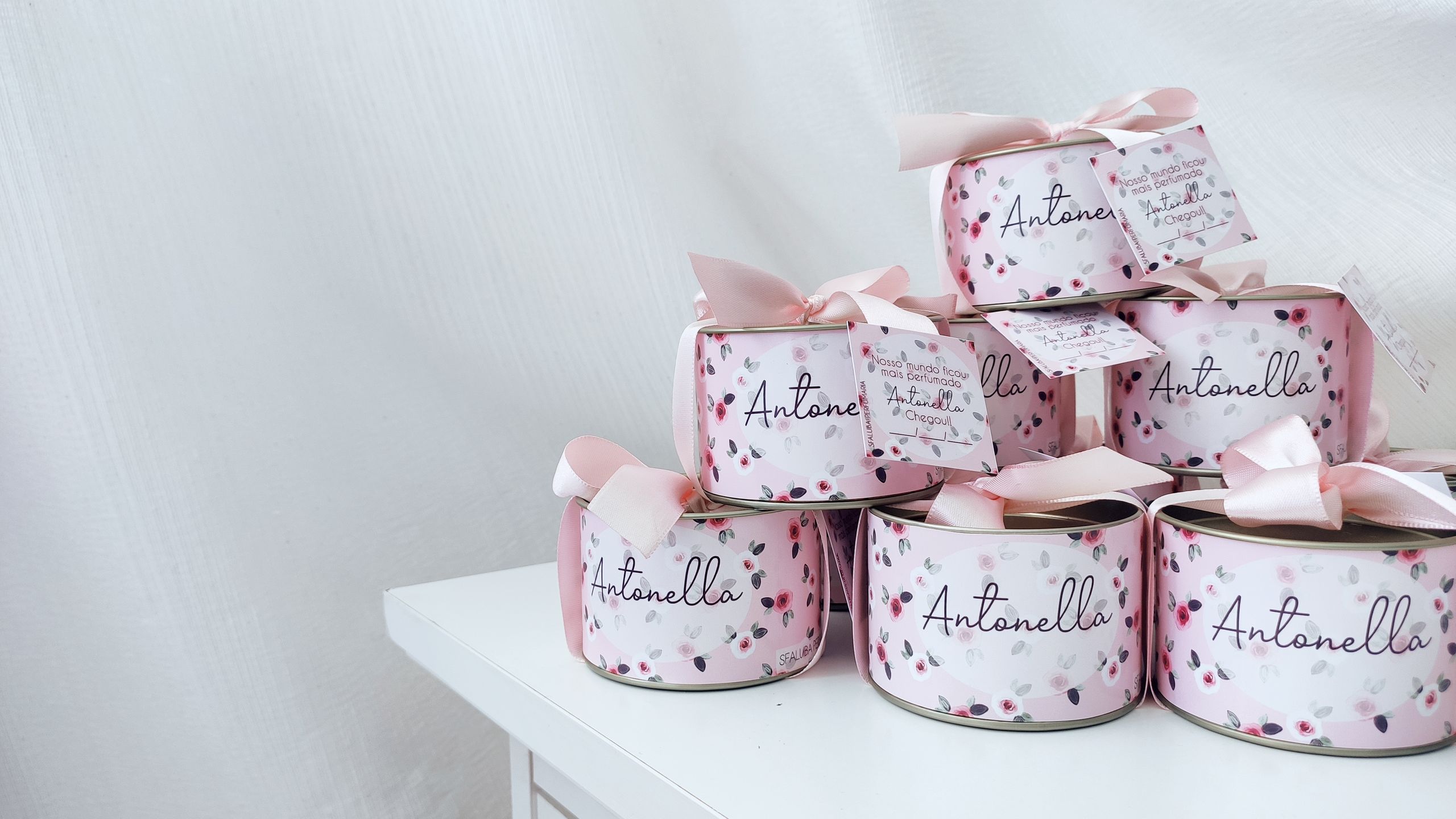 Beautifully arranged pink gift boxes with floral patterns and elegant ribbons, perfect for special occasions.