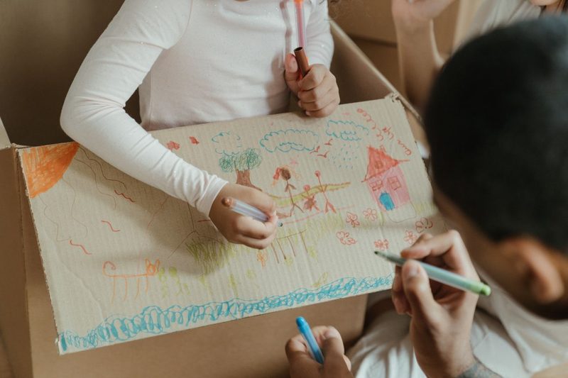 Kids drawing on a cardboard box, cardboard box crafts for kids