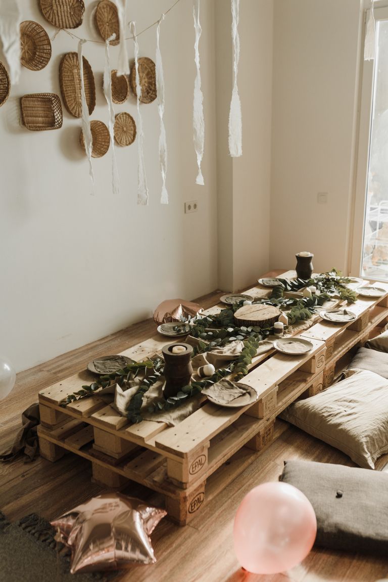 Cozy and rustic birthday dining setup with natural decor indoors.