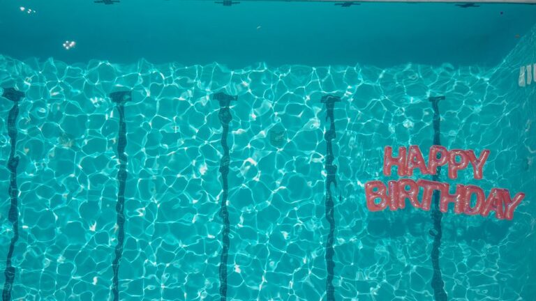 Top view of a swimming pool with a 'Happy Birthday' message, perfect for festive occasions. Stock Photo.